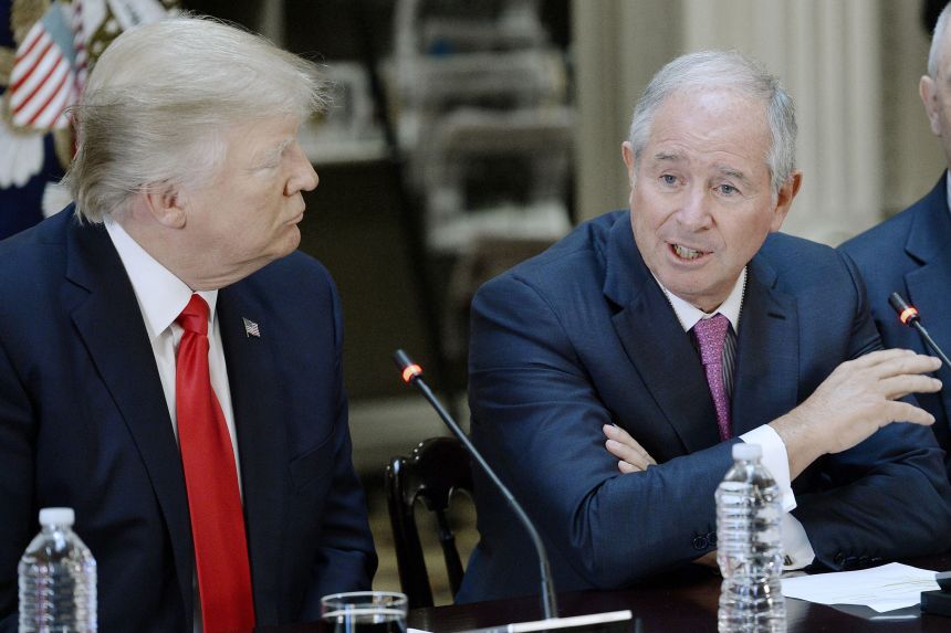 Stephen A. Schwarzman speaks alongside President Trump at a 2017 meeting.