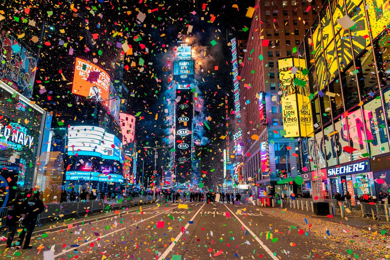 Confetti falls on a mostly empty Times Square in New York. This year, a limited live audience of first responders and essential workers and their families were allowed to watch the ball drop from a secure area.