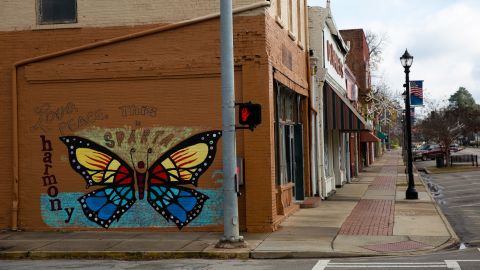 A mural declares, "This is Sparta," on a building downtown, where many storefronts sit empty.