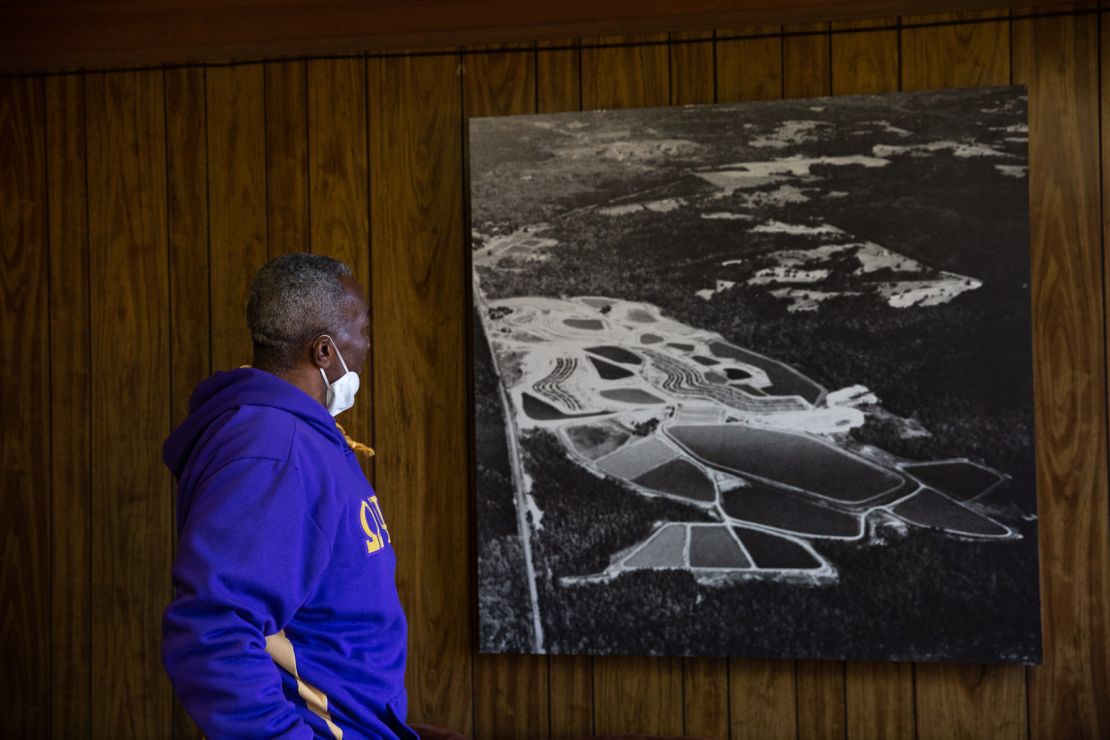 Thornton examines an old aerial photograph of his property, when it was a functioning catfish farm in Hancock County.
