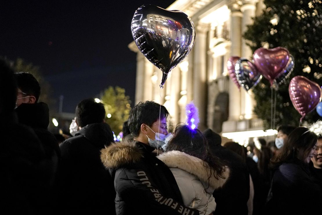 A couple kiss as New Year approaches on December 31, 2020 in Wuhan. 