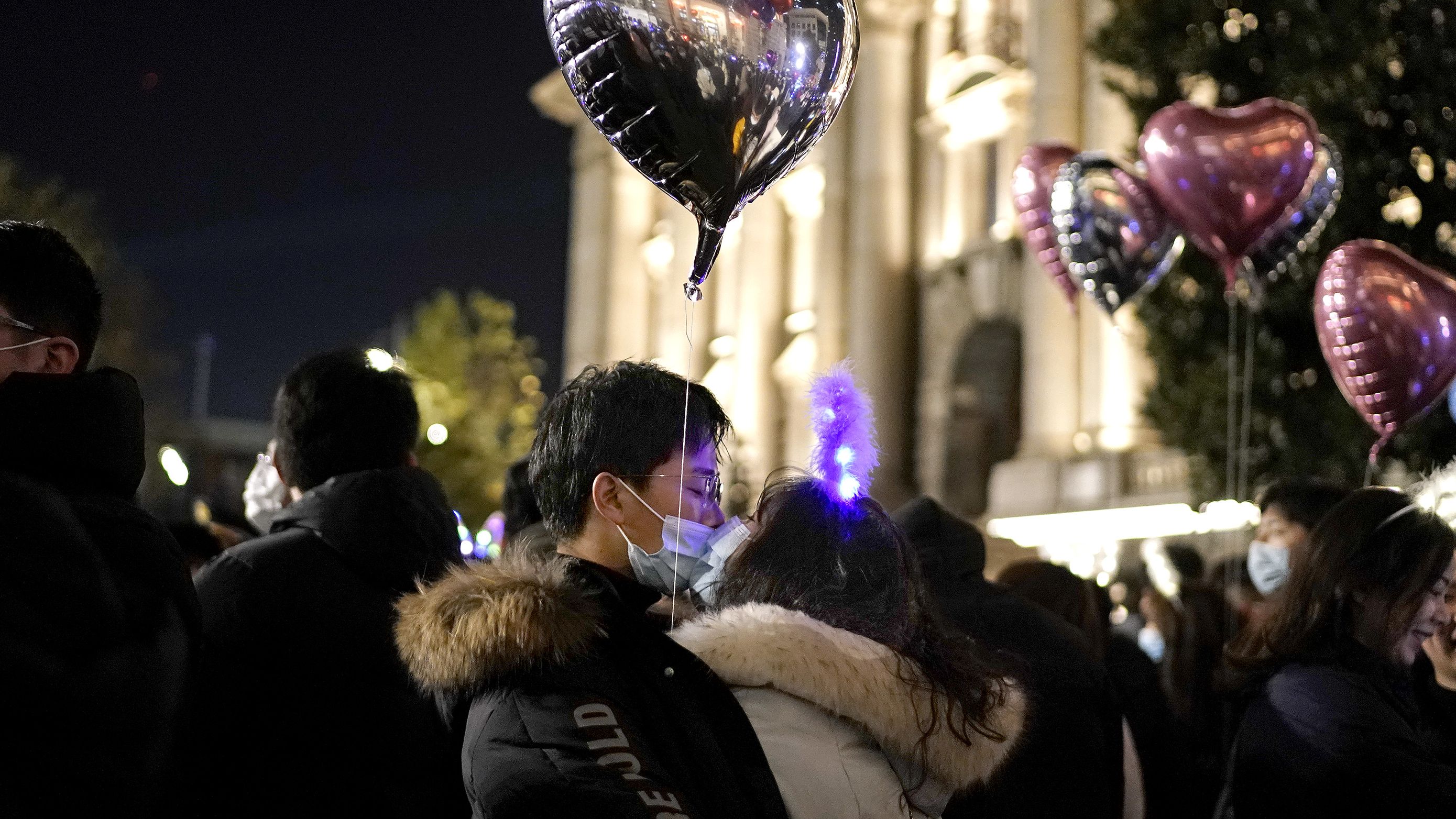 A couple kiss as New Year approaches on December 31, 2020 in Wuhan. 