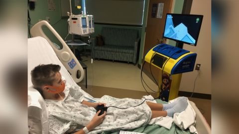 Keegan, a patient at Mary Bridge Children's Hospital in Tacoma, Washington, plays games on a Starlight Nintendo Switch gaming station.
