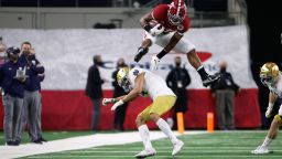 DALLAS, TX - JANUARY 1: Najee Harris #22 of the Alabama Crimson Tide hurdles a defender for a gain against the Notre Dame Fighting Irish in the Rose Bowl College Football Playoff Semifinal game at AT&T Stadium on January 1, 2021 in Dallas, Texas. (Photo by UA Athletics/Collegiate Images/Getty Images)