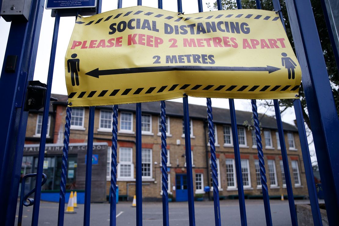 Social distancing signs are displayed at Coldfall Primary School in Muswell Hill on January 2, 2021 in London, England.