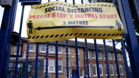 Social distancing signs are displayed at Coldfall Primary School in Muswell Hill on January 2, 2021 in London, England.