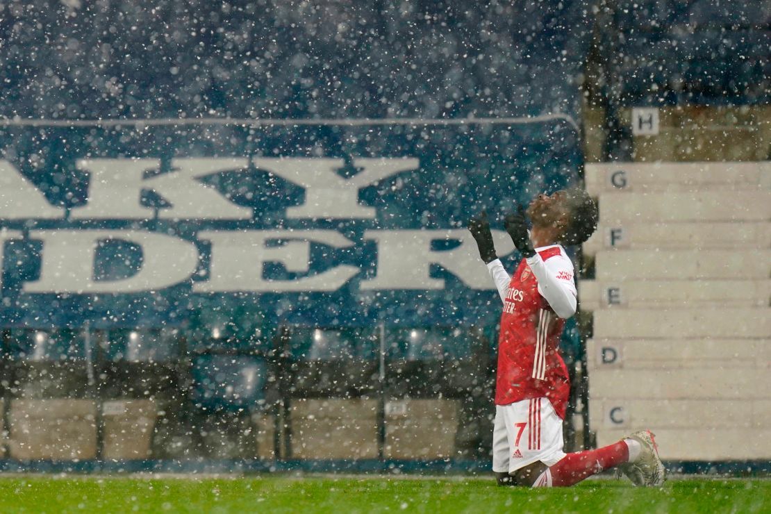 A wintery scene at The Hawthorns as Bukayo Saka celebrates Arsenal's superb second goal in the 4-0 win over West Bromwich Albion. 