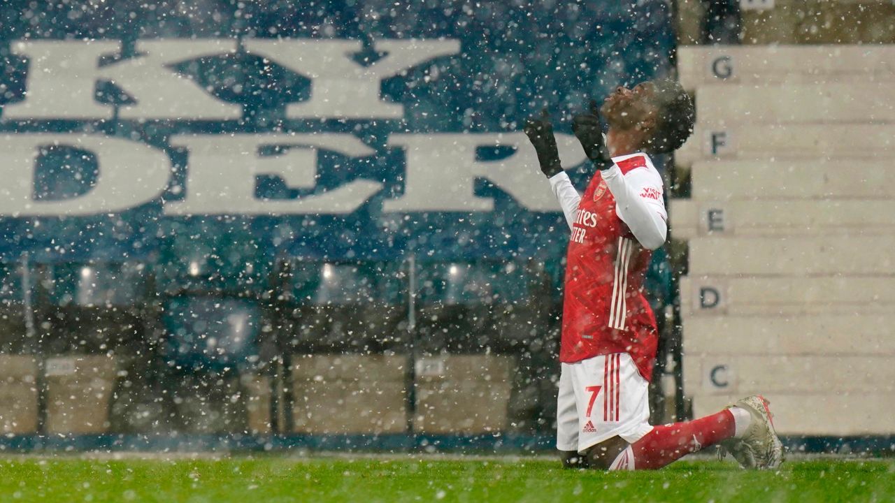 A wintery scene at The Hawthorns as Bukayo Saka celebrates Arsenal's superb second goal in the 4-0 win over West Bromwich Albion.