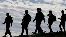 Members of the Israel Defense Forces (IDF) arrive at the site where a Palestinian house was demolished near Hebron in the West Bank on November 25, 2020.