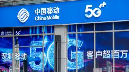  Chinese state-owned telecommunication corporation China Mobile store and logo and 5G sign seen in Shenzhen.