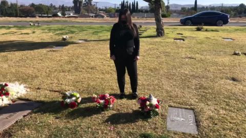 Rosa Cerna visits the graves of her dad and uncle, who both died of Covid-19.
