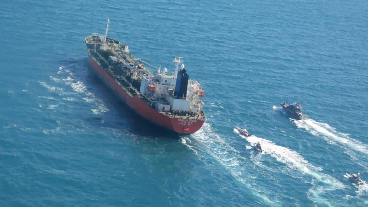 In this photo released Monday, Jan. 4, 2021, by Tasnim News Agency, a seized South Korean-flagged tanker is escorted by Iranian Revolutionary Guard boats on the Persian Gulf.