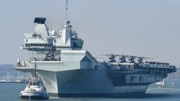 PORTSMOUTH, ENGLAND - SEPTEMBER 21: HMS Queen Elizabeth departs from the Naval base on September 21, 2020 in Portsmouth, England. The £3 billion aircraft carrier was due to sail last week but was delayed due to high easterly winds. The 65,000-tonne aircraft carrier's entire crew has been retested for Covid-19 with approximately 100 sailors having to self-isolate after 'fewer than 10' tested positive. (Photo by Finnbarr Webster/Getty Images)