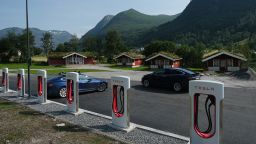 Tesla cars stand at a Tesla Supercharger charging station on August 12, 2020 in Skei, Norway. Norway has the highest percentage of electric cars per capita in the world. In March, 2020, all-electric electric car sales accounted for 55.9% of new car sales. (Photo by Sean Gallup/Getty Images,)