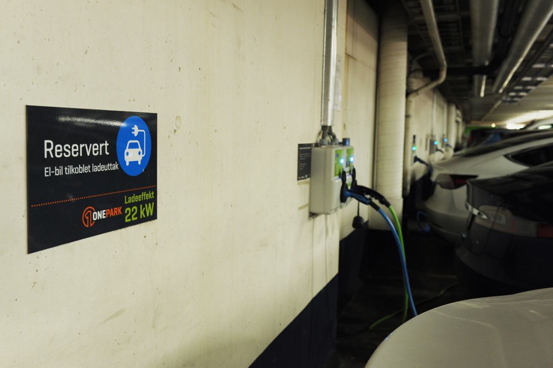 Electric cars charging in a parking lot on March 29, 2019 in Oslo, Norway.