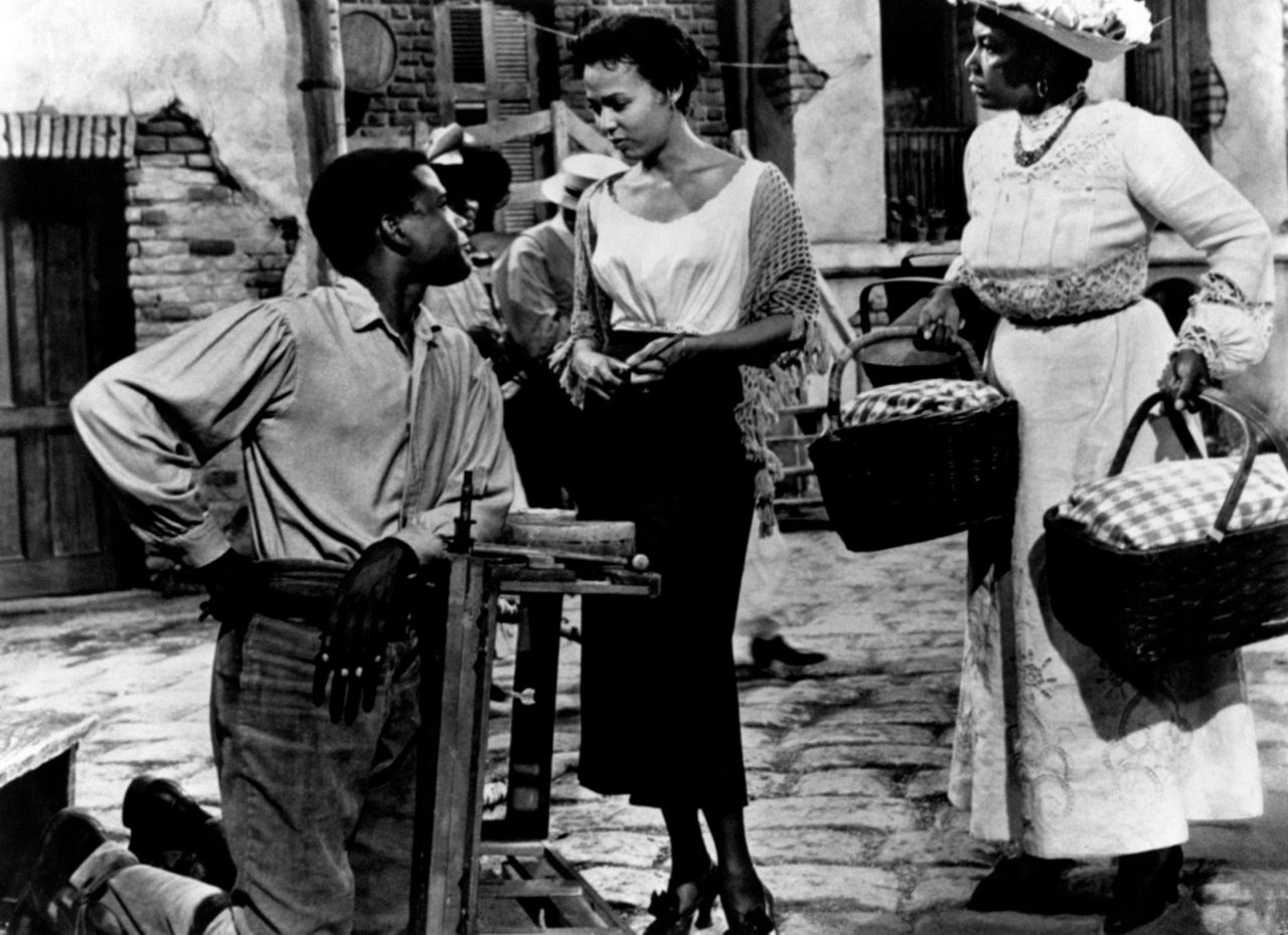 Poitier talks to Dorothy Dandridge in the 1959 musical "Porgy and Bess." At right is Pearl Bailey.