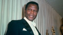 Bahamian American actor Sidney Poitier holding his Academy Award for Best Actor in a Leading Role for 'Lilies Of The Field', directed by Ralph Nelson, at the 36th Academy Awards ceremony, 13th April 1964. The ceremony was held at the Santa Monica Civic Auditorium, Santa Monica, California. (Photo by Archive Photos/Getty Images) 
