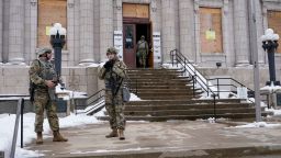 National guard members stage outside a museum Tuesday, Jan. 5, 2021, in Kenosha, Wis. An announcement is expected on whether any police officers will be charged in the Aug. 2020 shooting of Jacob Blake.