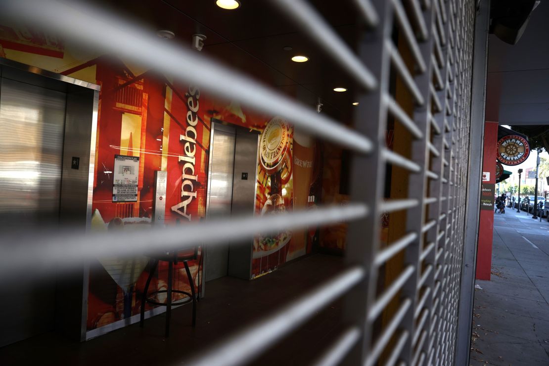 A security gate blocks the entrance to a closed Applebee's restaurant on August 13, 2020 in San Francisco, California. 
