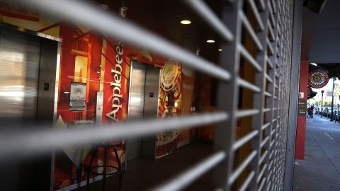 A security gate blocks the entrance to a closed Applebee's restaurant on August 13, 2020 in San Francisco, California.