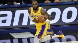 Los Angeles Lakers forward LeBron James handles the ball in the first half of an NBA basketball game against the Memphis Grizzlies Tuesday, Jan. 5, 2021, in Memphis, Tenn. (AP Photo/Brandon Dill)