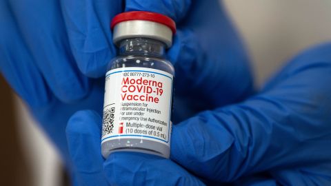 Michelle Chester, director of employee health services at Northwell Health, shows the Moderna Covid-19 vaccine at Long Island Jewish Valley Stream Hospital on December 21, 2020, in Valley Stream, New York.