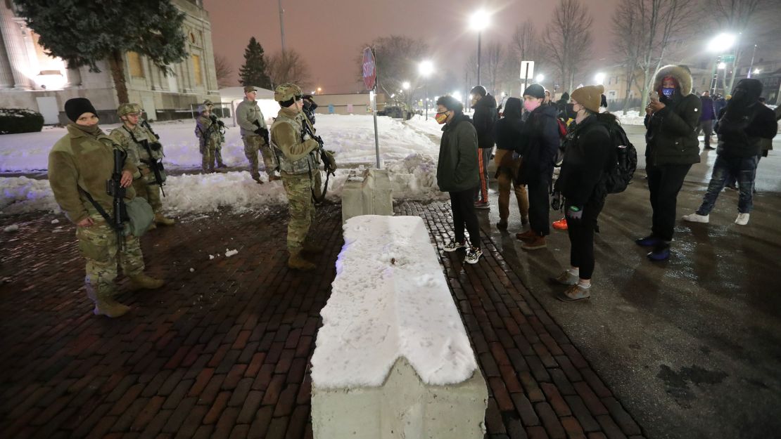 Protesters confronted National Guard members near the Kenosha County Courthouse on Tuesday night.