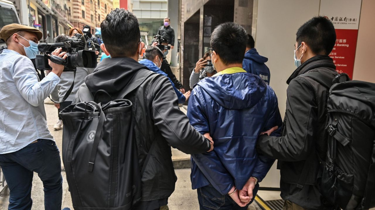 District councilor Ben Chung led away by police in Hong Kong. Chung was one of dozens of pro-democracy activists and politicians arrested on January 6, 2020.