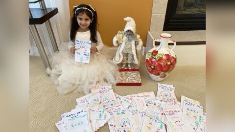 Aryana with the 200 cards and gifts she bought for residents of the Willow Point nursing home.