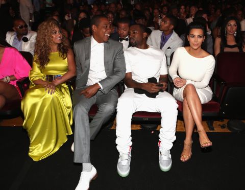 Kim and Kanye sit with another famous celebrity couple — Beyonce and Jay-Z — at the BET Awards in July 2012.