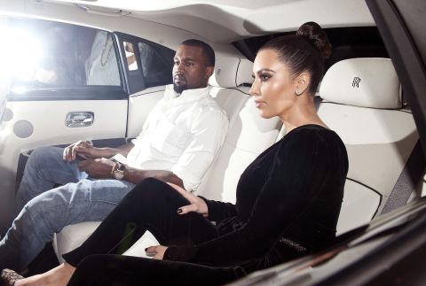 Kim and Kanye sit in the back seat of a vehicle while in London in November 2012.