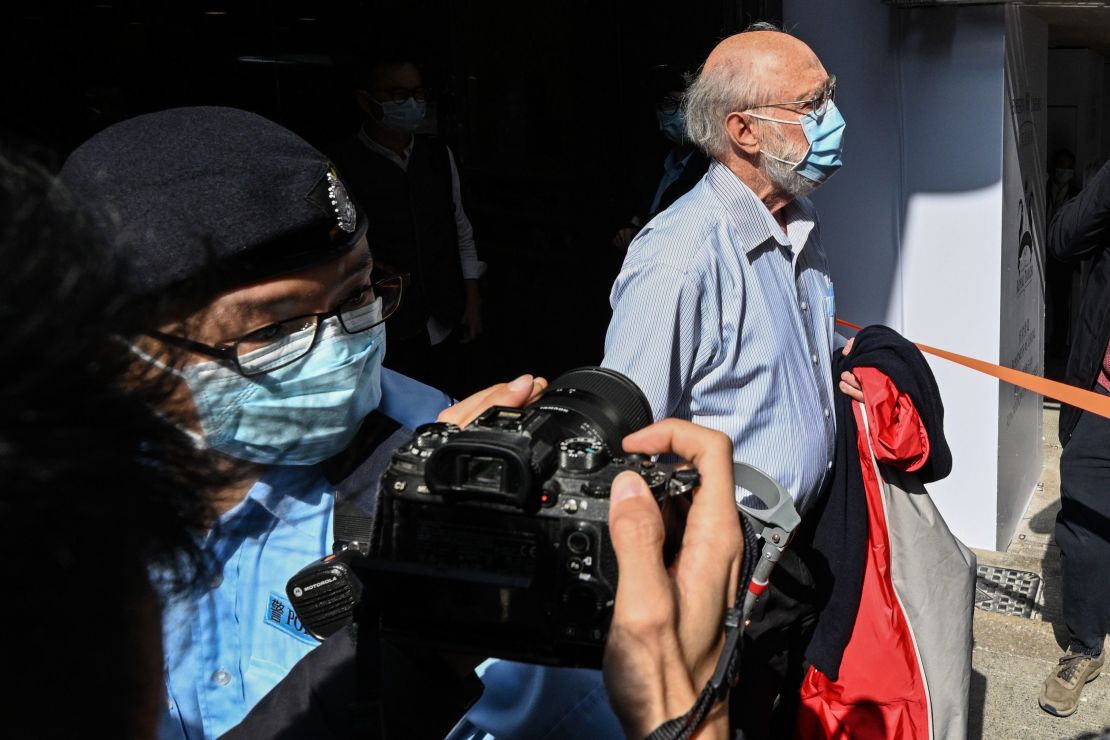 John Clancey, a US solicitor with law firm Ho Tse Wai and Partners that is known for taking on human rights cases, is led away by police after he was arrested under a national security law in Hong Kong on January 6, 2021.