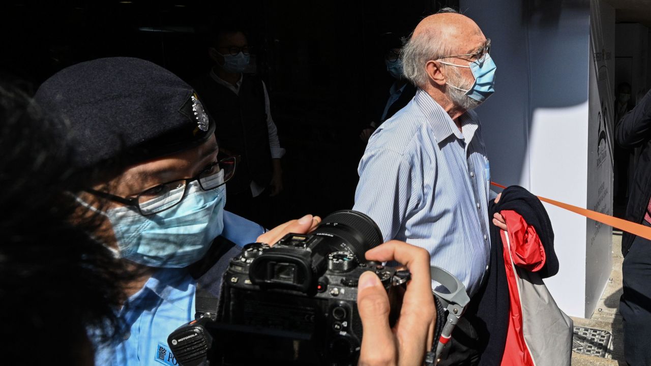 John Clancey, a US solicitor with law firm Ho Tse Wai and Partners that is known for taking on human rights cases, is led away by police after he was arrested under a national security law in Hong Kong on January 6, 2021.