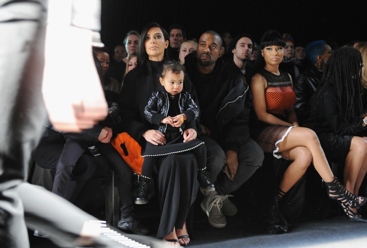 Kim holds North as Kanye and rapper Nicki Minaj attend a fashion show in New York in February 2015.