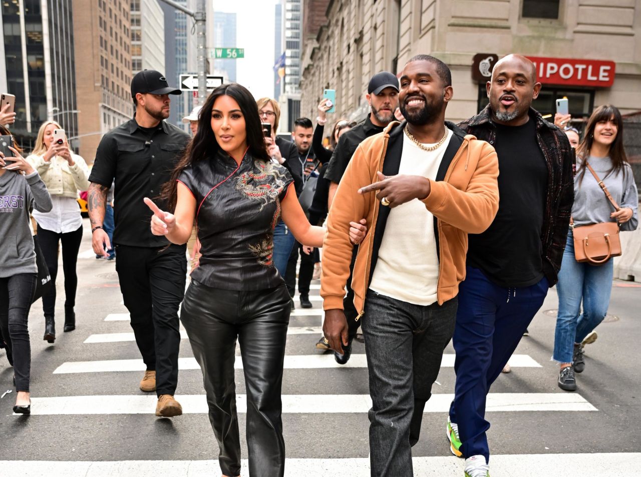 The couple walks along Sixth Avenue in New York in October 2019.