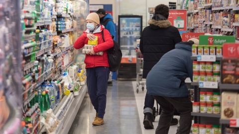 Shoppers wear face masks at a Montreal pharmacy in the first weekend of 2021.