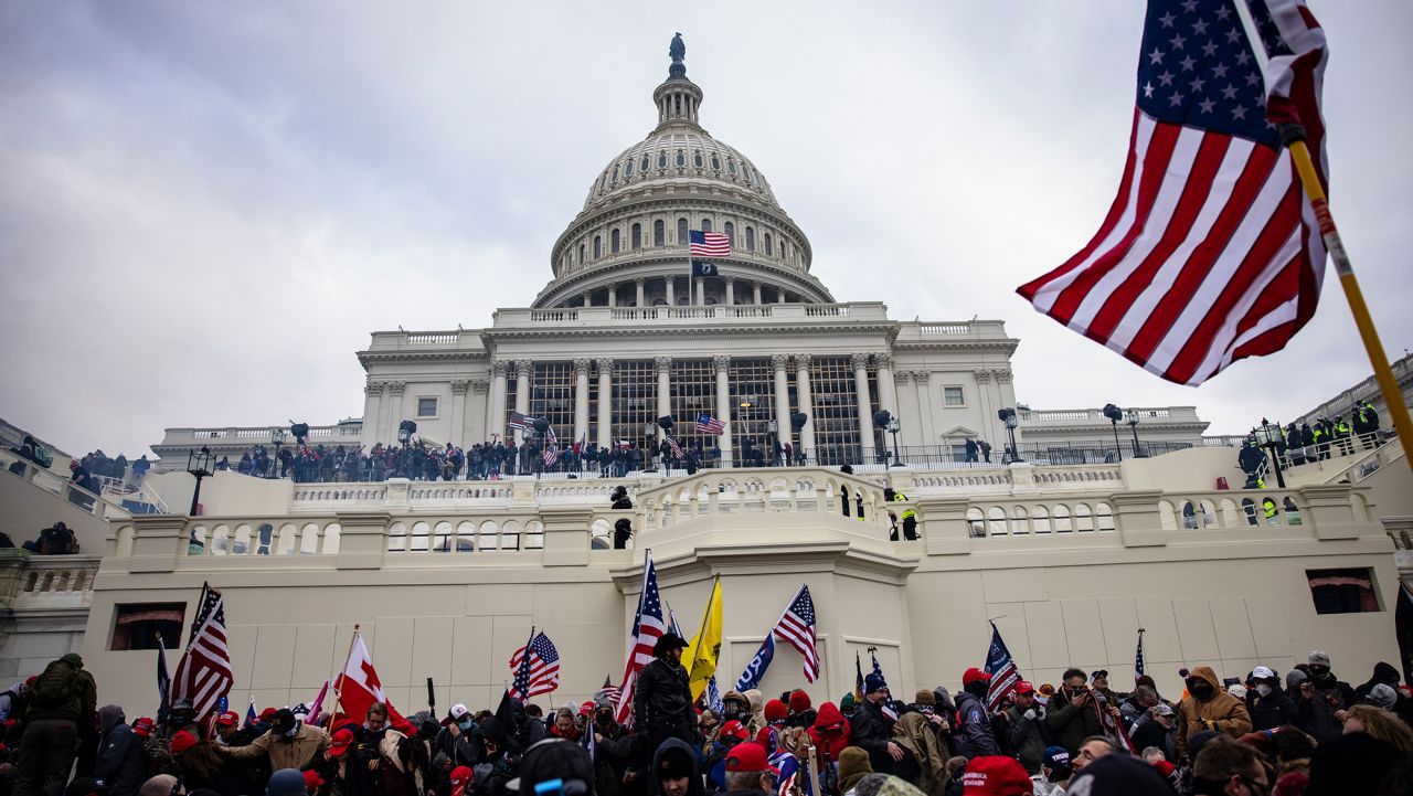 WASHINGTON, DC - JANUARY 06: Pro-Trump supporters storm the U.S. Capitol following a rally with President Donald Trump on January 6, 2021 in Washington, DC. Trump supporters gathered in the nation's capital today to protest the ratification of President-elect Joe Biden's Electoral College victory over President Trump in the 2020 election. (Photo by Samuel Corum/Getty Images)