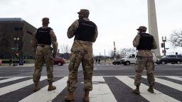 Members of the DC National Guard provide traffic control at an intersection near a rally at Freedom Plaza Tuesday, Jan. 5, 2021, in Washington, in support of President Donald Trump. (AP Photo/Jacquelyn Martin)