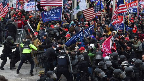 Trump supporters clash with police and security forces as they push barricades to storm the US Capitol in Washington on Wednesday, January 6.