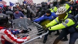 Trump supporters try to break through a police barrier, Wednesday, Jan. 6, 2021, at the Capitol in Washington. As Congress prepares to affirm President-elect Joe Biden's victory, thousands of people have gathered to show their support for President Donald Trump and his claims of election fraud.(AP Photo/John Minchillo)