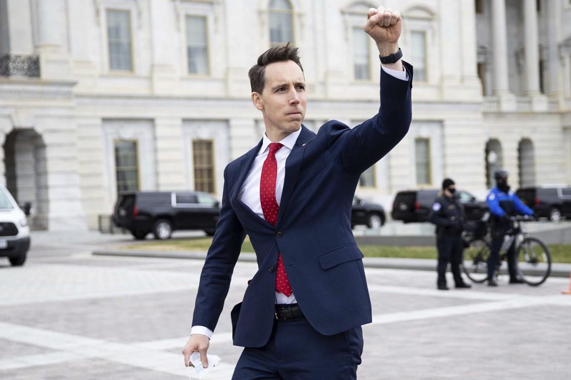 Sen. Josh Hawley gestures toward a crowd of supporters of President Donald Trump gathered outside the US Capitol to protest the certification of President-elect Joe Biden's electoral college victory Jan. 6, 2021. Some demonstrators later breached security and stormed the Capitol. 