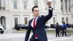 Sen. Josh Hawley (R-Mo.) gestures toward a crowd of supporters of President Donald Trump gathered outside the U.S. Capitol to protest the certification of President-elect Joe Biden's electoral college victory Jan. 6, 2021 at the US Capitol in Washington, DC. Some demonstrators later breached security and stormed the Capitol. (Francis Chung/E&E News and Politico via AP Images)