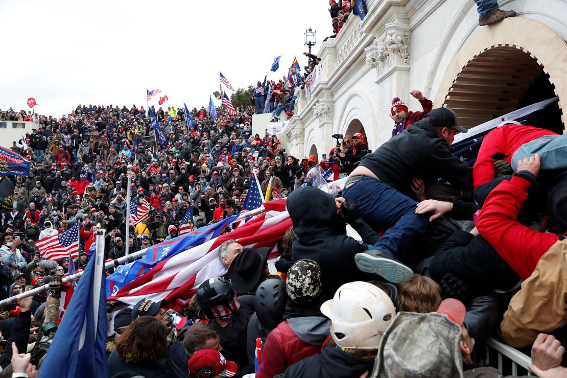 Pro-Trump insurgents storm into the US Capitol during clashes with police, during an insurrection to contest the certification of the 2020 US presidential election results by the US Congress in Washington on January 6. 
