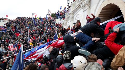 Pro-Trump insurgents storm into the US Capitol during clashes with police, during an insurrection to contest the certification of the 2020 US presidential election results by the US Congress in Washington on January 6.