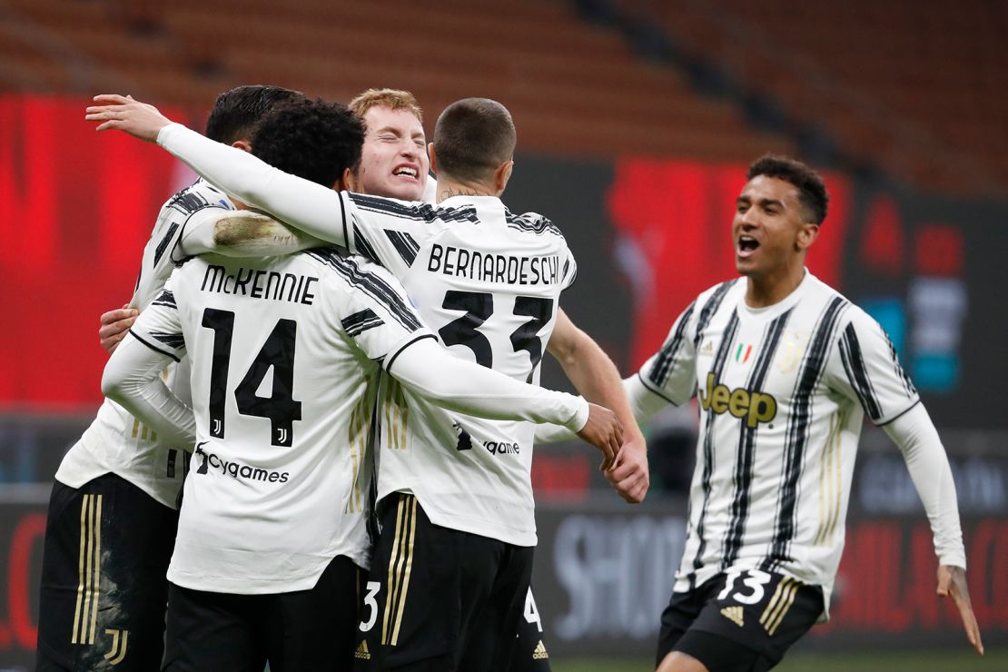 Juventus' McKennie celebrates with teammates after scoring his side's third goal against AC Milan.