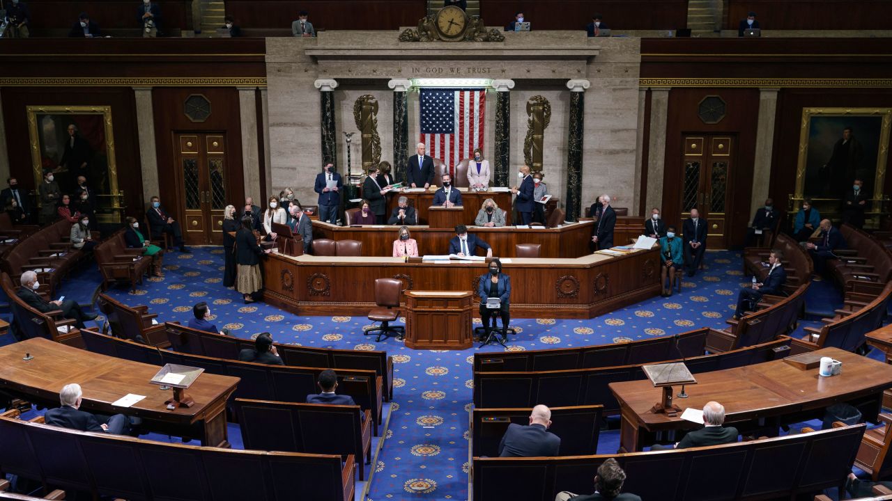 Vice President Mike Pence and Speaker of the House Nancy Pelosi, D-Calif., stand after reading the final certification of Electoral College votes cast in November's presidential election on January 7.