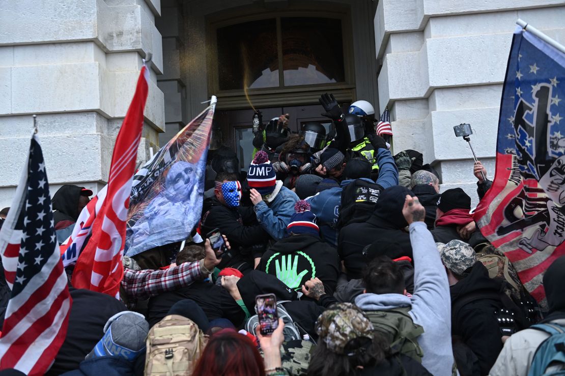 Trump supporters clash with police as they storm the US Capitol on January 6, 2021.