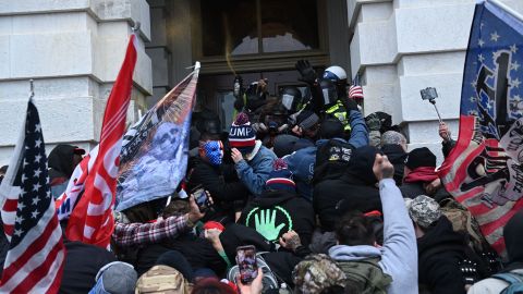 Trump supporters clash with police as they storm the US Capitol on January 6, 2021. 