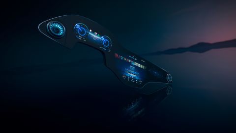 The Mercedes MBUX Hyperscreen curves outward at its ends, following the contours of the dashboard.