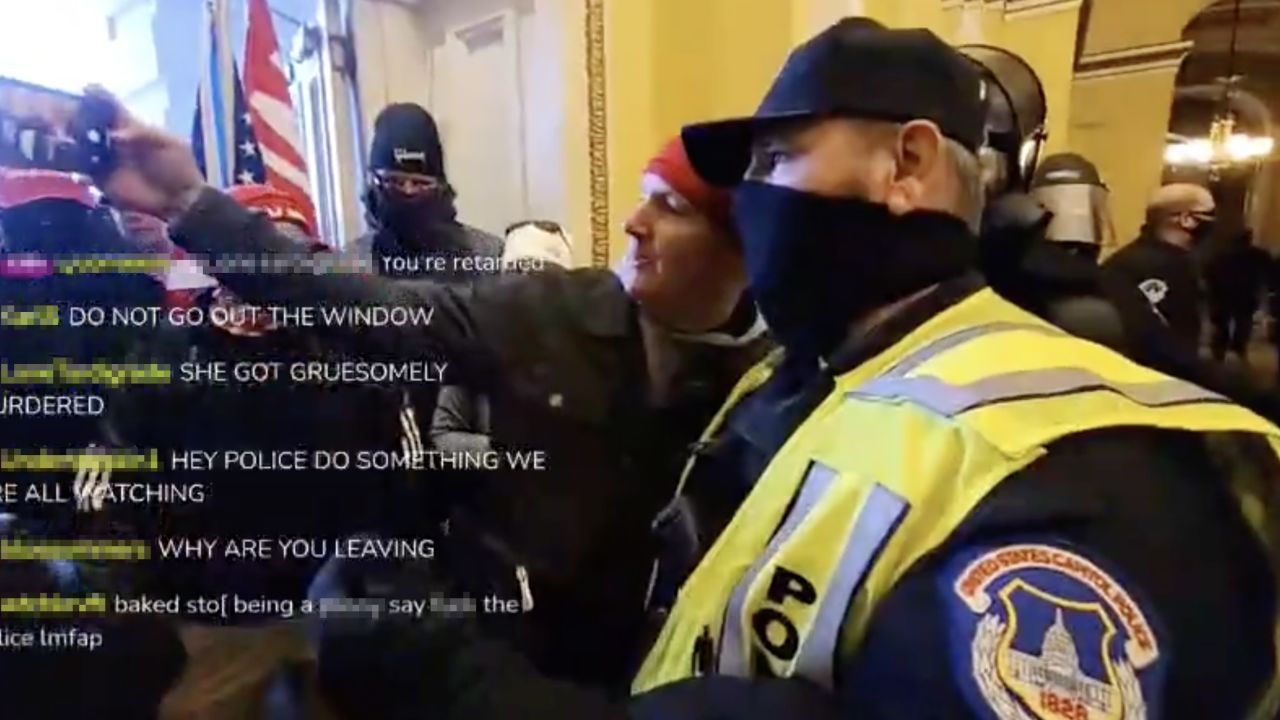 Livestream video appears to show a Capitol Hill police officer taking a selfie with a rioter inside the building.  
 
The snippet of livestream posted online is short and it's unclear what prompted, or followed, the interaction.
CNN has reached out to the Capital Hill Police for comment about the incident.